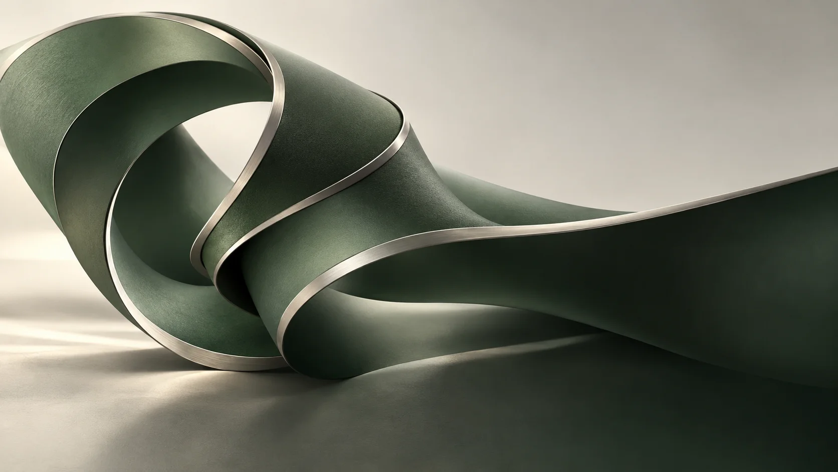 An abstract folded green sculpture, with sweeping connected layers and silver edges.
